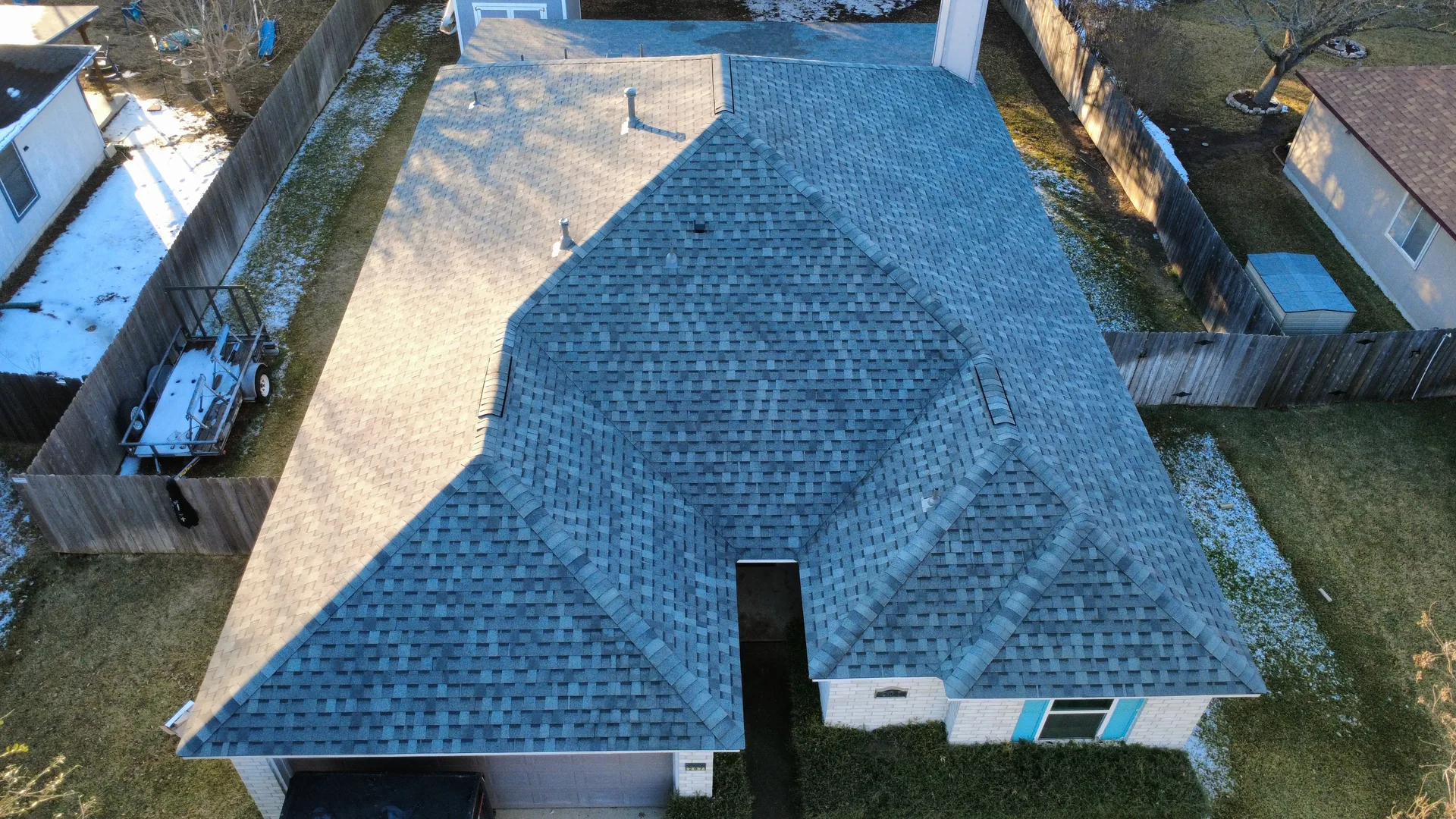 Aerial blue shingle hip roof, Hutto, TX