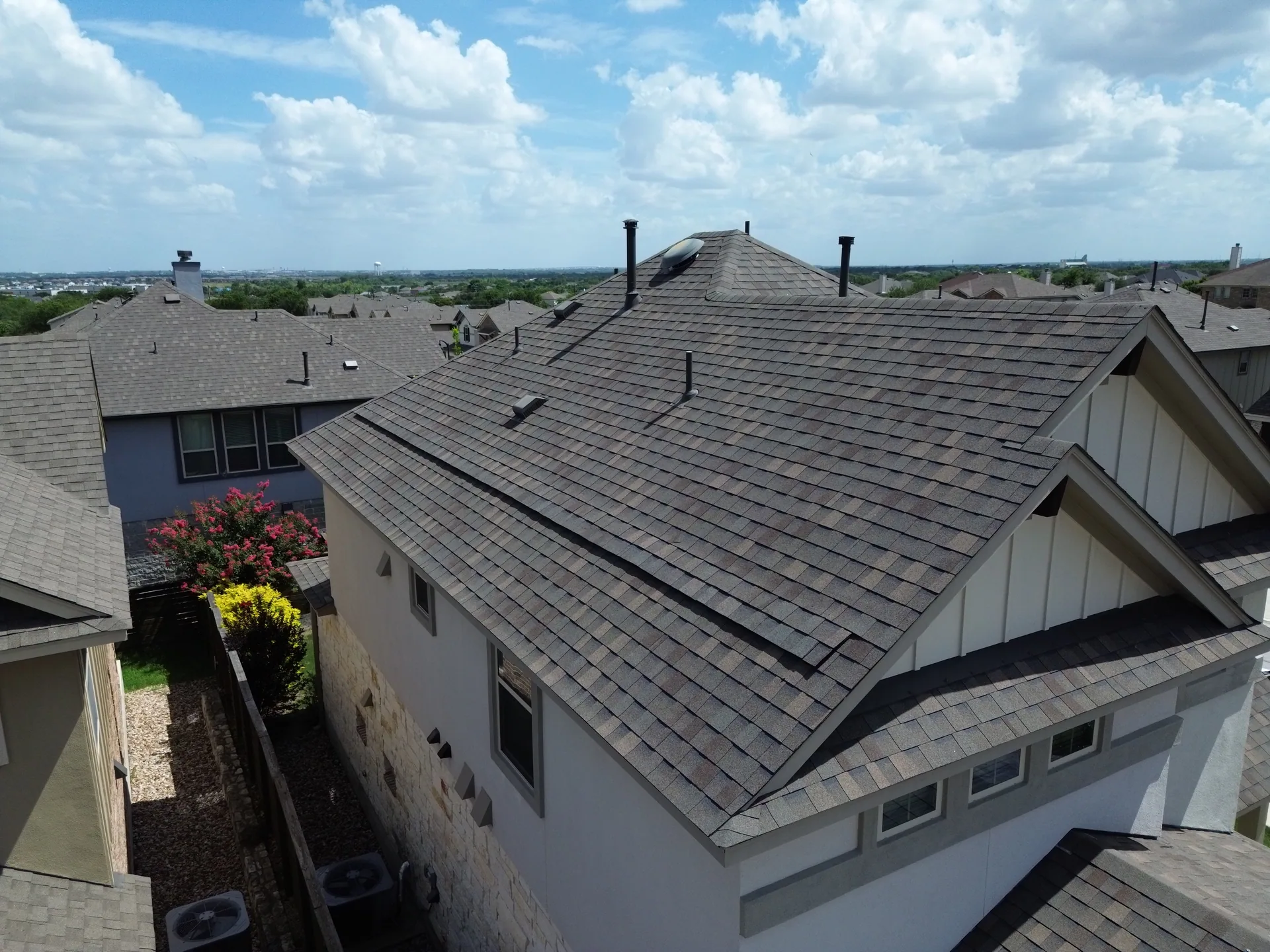 Brown shingle roof board batten gables, Hutto, TX