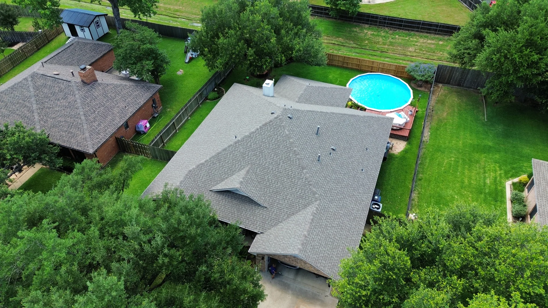 Gray shingle roof above ground pool, Hutto, TX