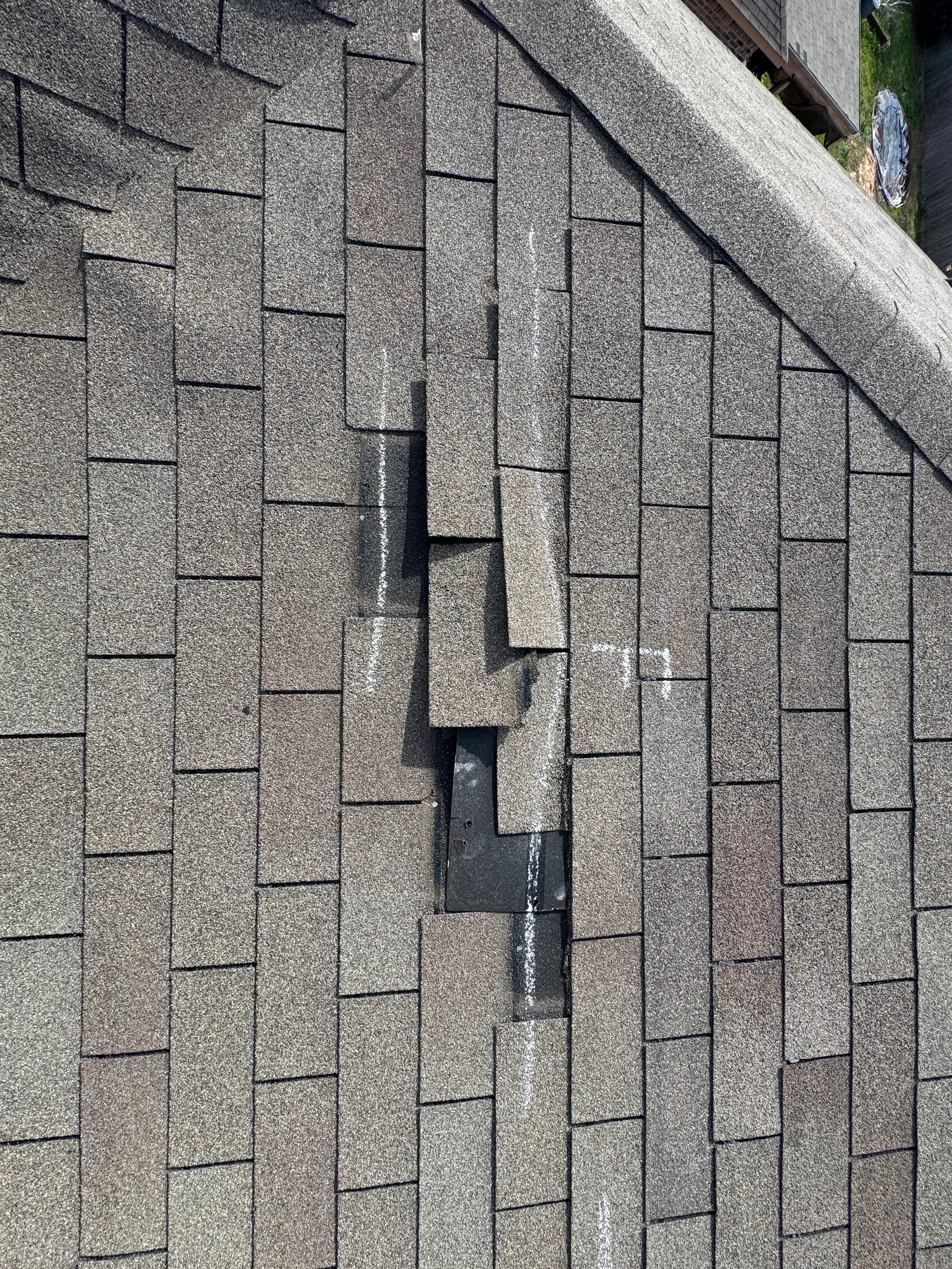 Lifted creased shingle tabs wind damage, Hutto, TX