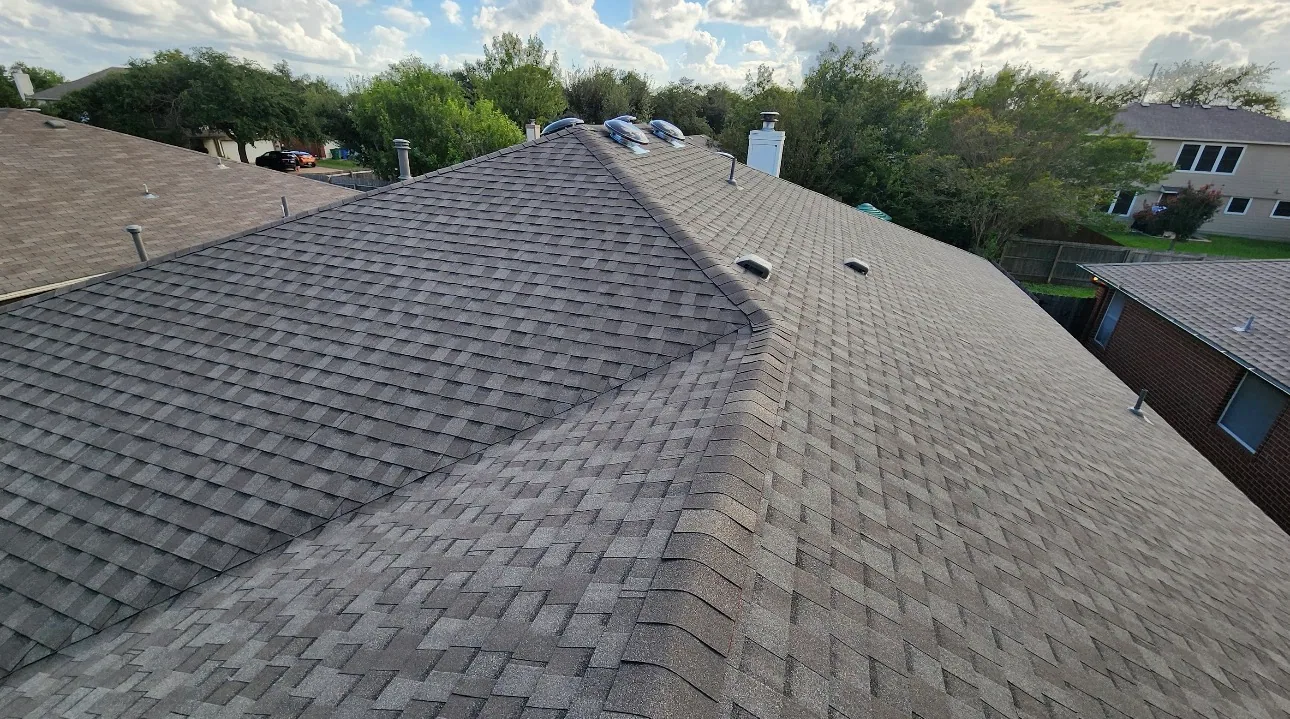 Turbine vents hip ridge brown shingle roof, Hutto, TX